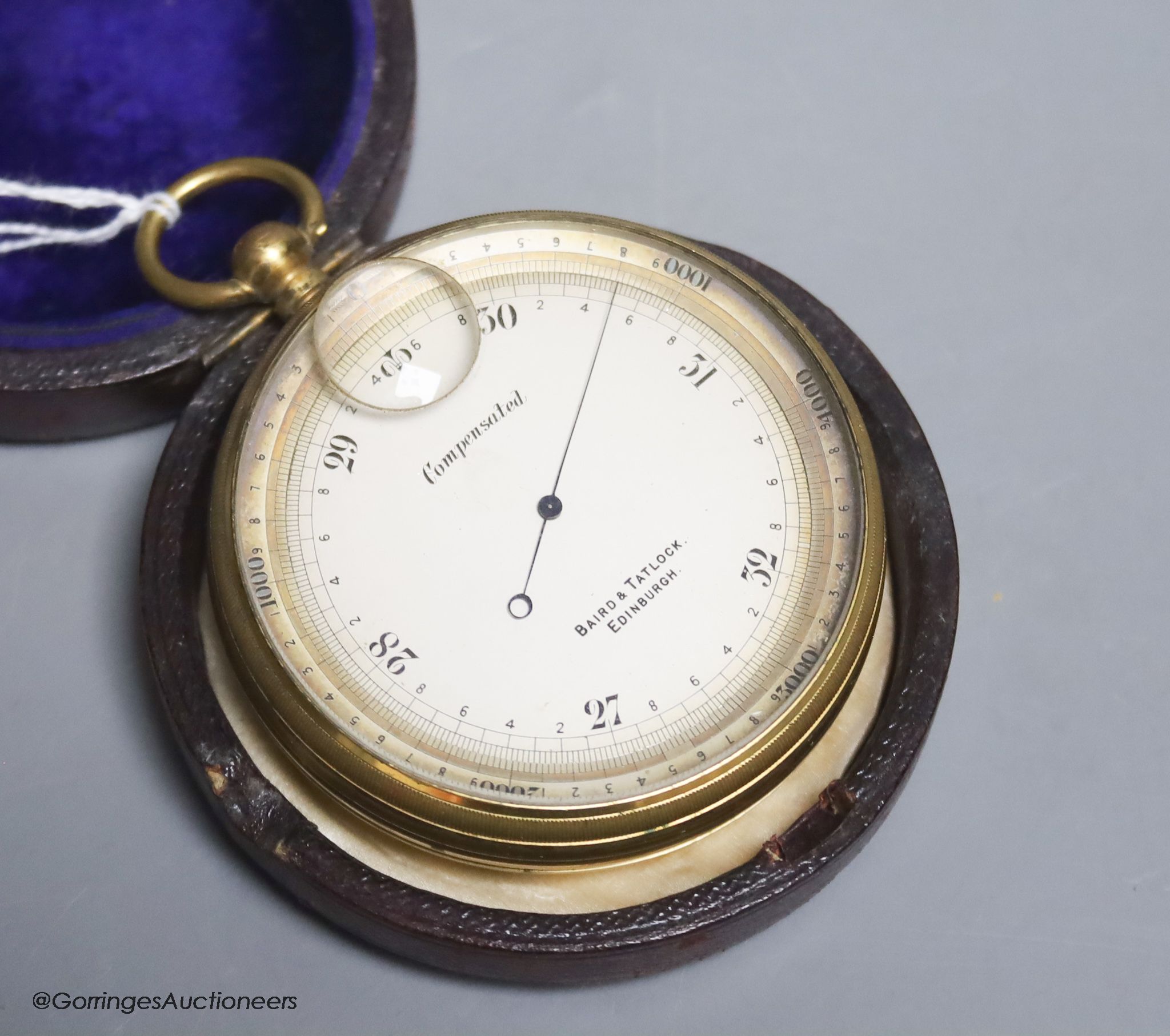 A cased pocket barometer